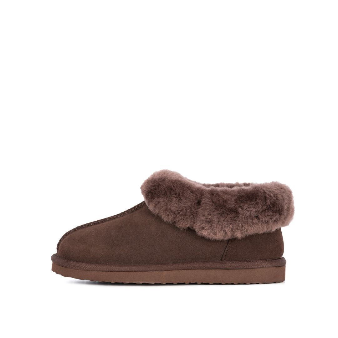 A brown sheepskin slipper bootie with a turned-up cuff, made of Australian sheepskin, with a non-slip sole.